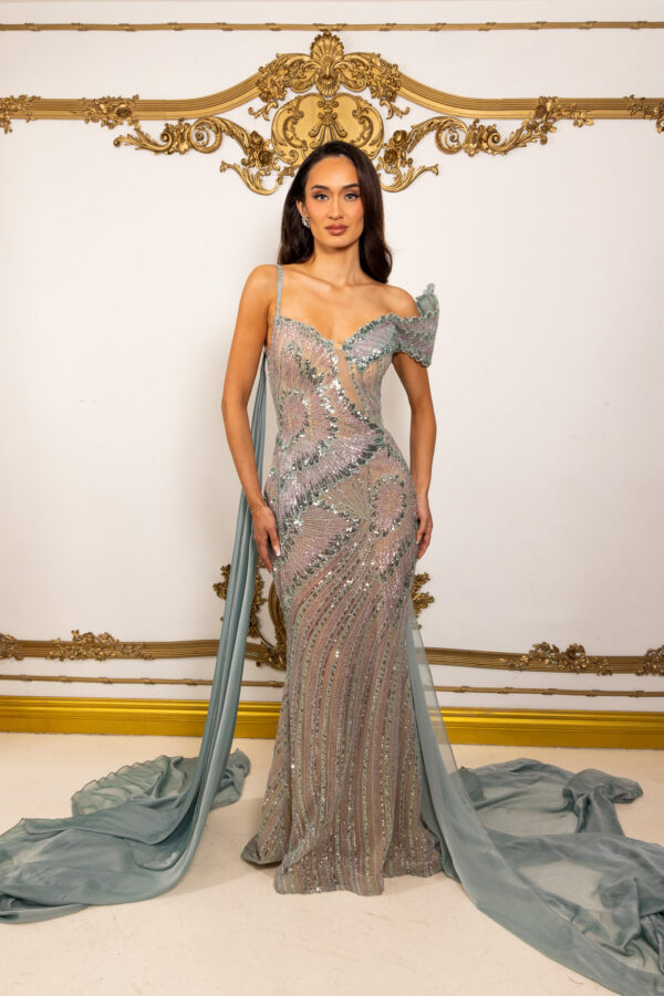 Elegant off-the-shoulder mermaid evening gown in shimmering sage green sequins with intricate floral embroidery, sheer illusion details, asymmetric straps, and flowing chiffon train.
